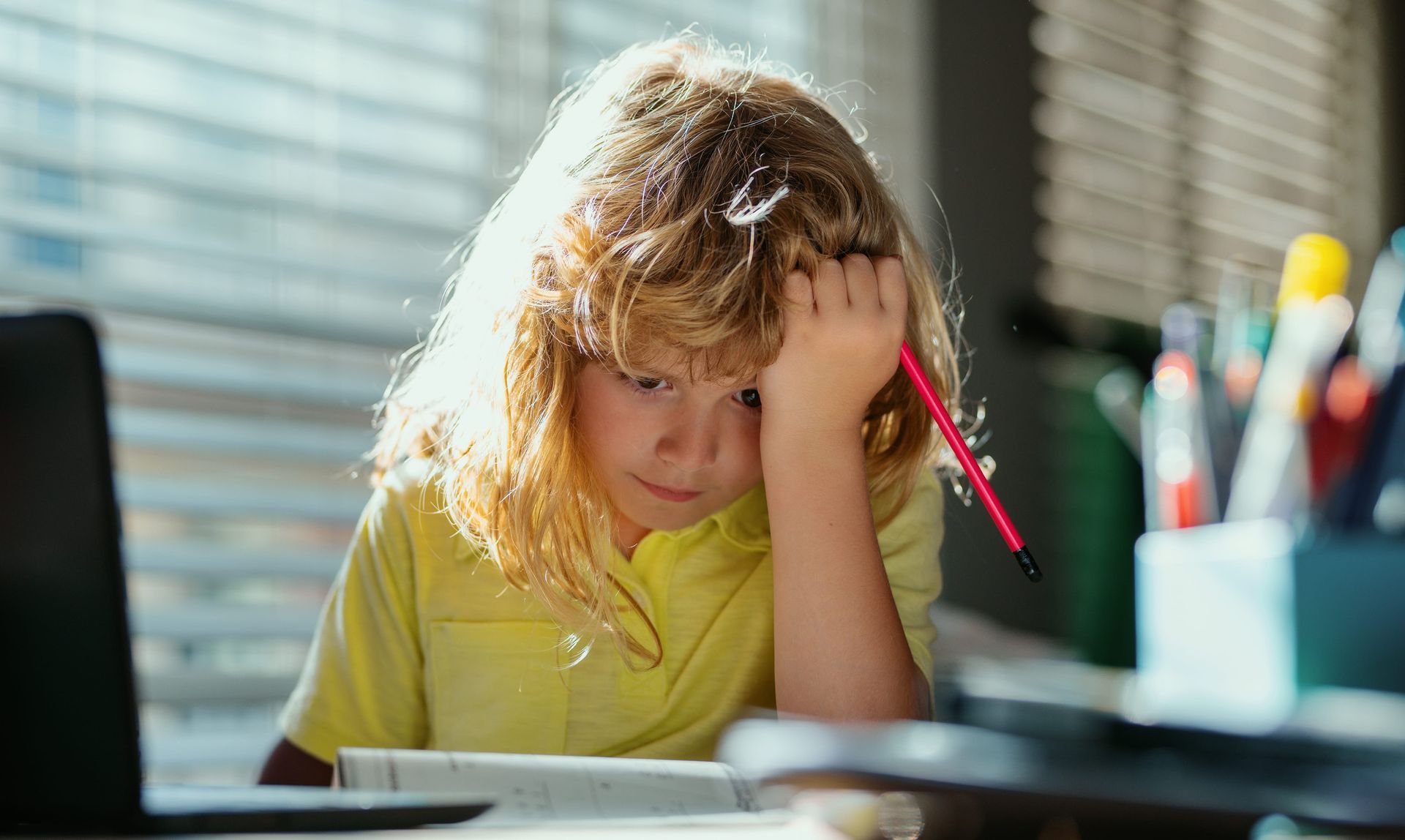 Child struggling with maths homework needing extra support and guidance at home.