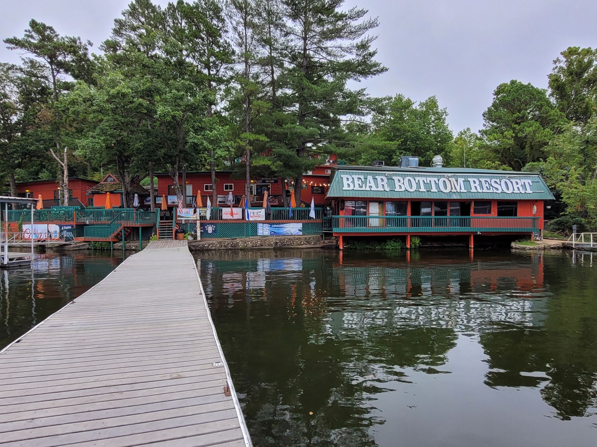 A dock leading to a building that says rear bottom resort