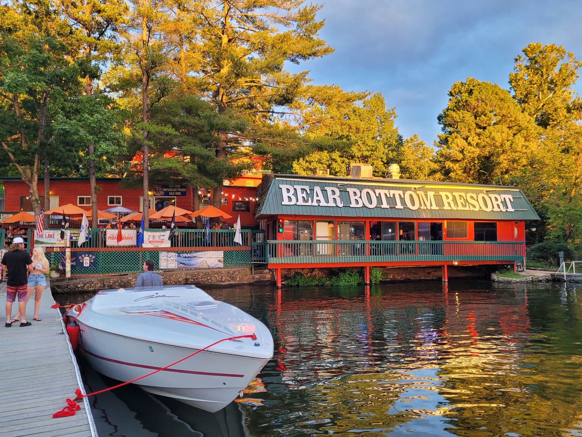 A boat is docked in front of the bear bottom resort