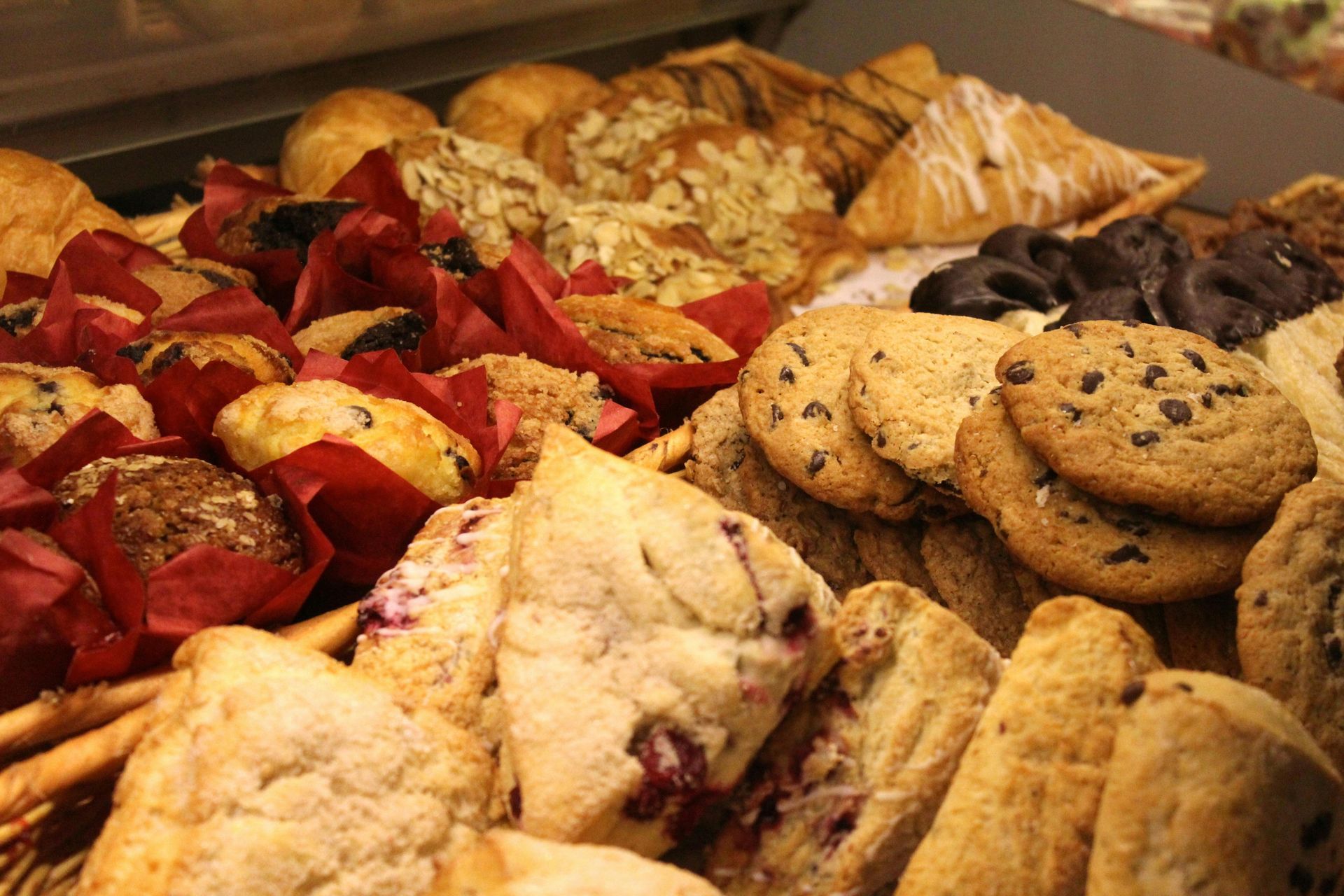 A variety of baked goods including cookies muffins and croissants