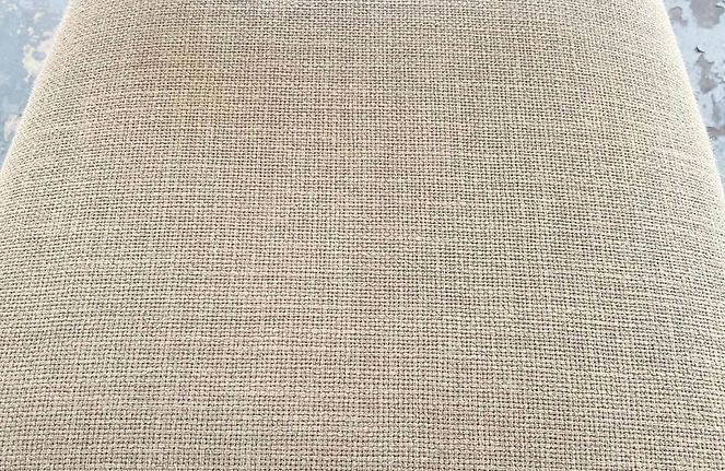 A close up of a piece of fabric with a grid pattern.