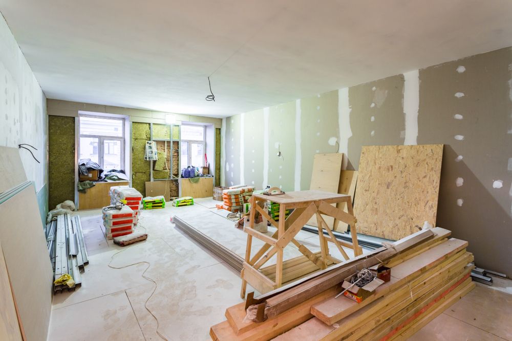 A Room Under Construction With a Lot of Wood and Tools — Knobel Builders In Balgownie, NSW