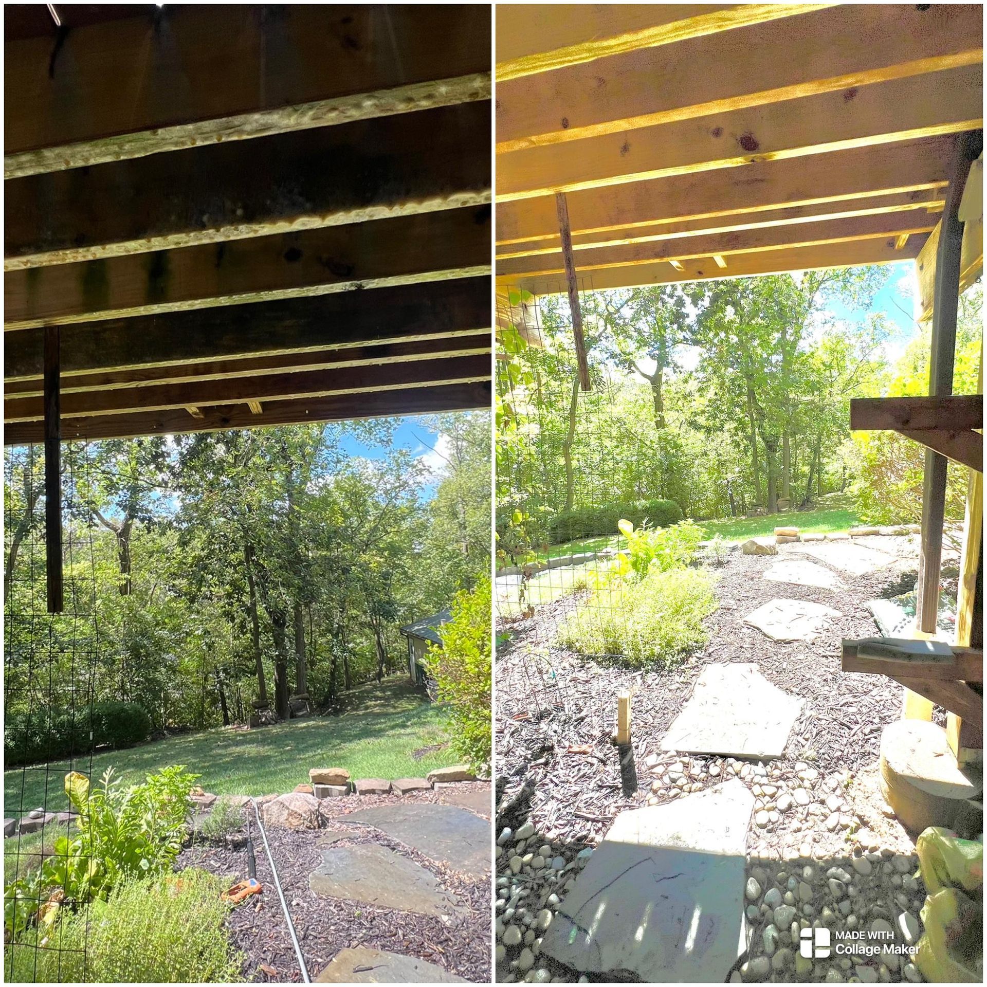 View from under a wooden deck overlooking a sunny garden path with stone steps and trees.