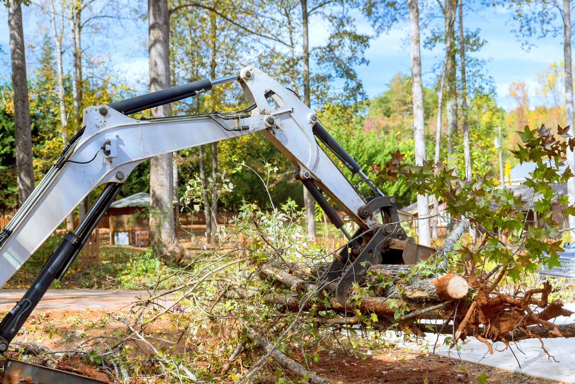 An excavator is digging a hole in the ground at a construction site. An excavator is digging a hole in the ground at a construction site.