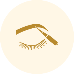Gold cosmetic eye makeup icon on a pale cream circle background