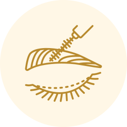 Gold line icon of a cosmetic syringe injecting the under-eye area on a beige circle background