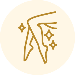 Gold line art of crossed ballet pointe shoes with sparkles on a pale cream circle