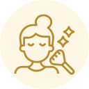 Gold line icon of a smiling person with a bun, holding a makeup brush and sparkle symbols.