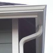 A close up of a window with a handle on it.
