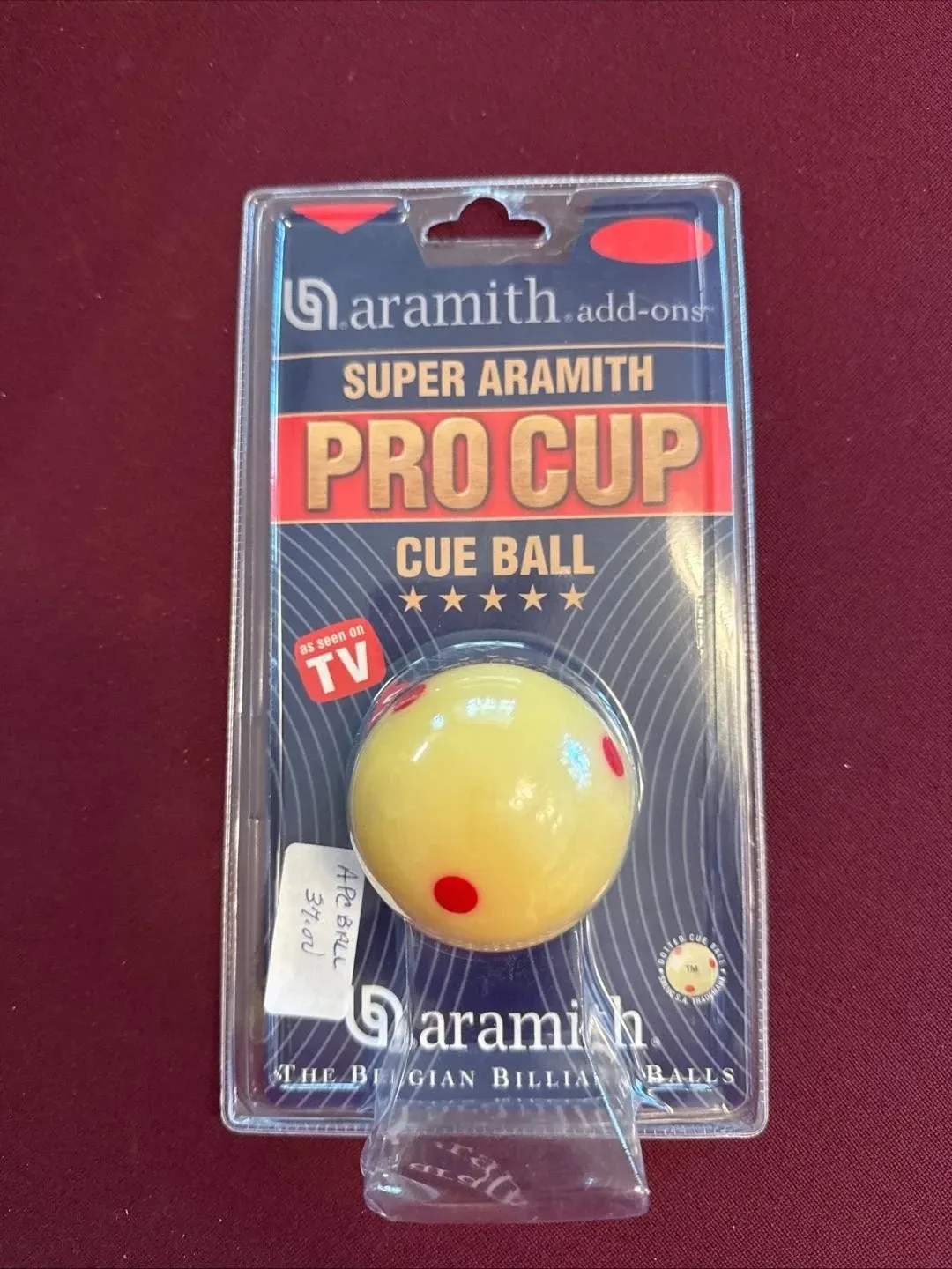 Packaged Aramith Super Aramith Pro Cup cue ball, white with red spots, in clear plastic packaging