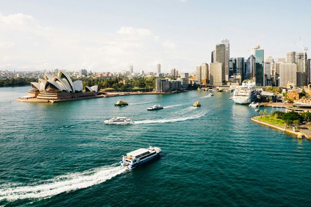 A Group of Boats Are Floating on Top of a Body of Water — Mentally Hooked in Sydney, QLD