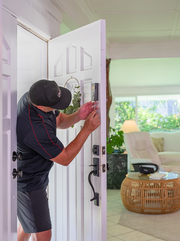 Honolulu handyman repairing interior door as part of home maintenance service