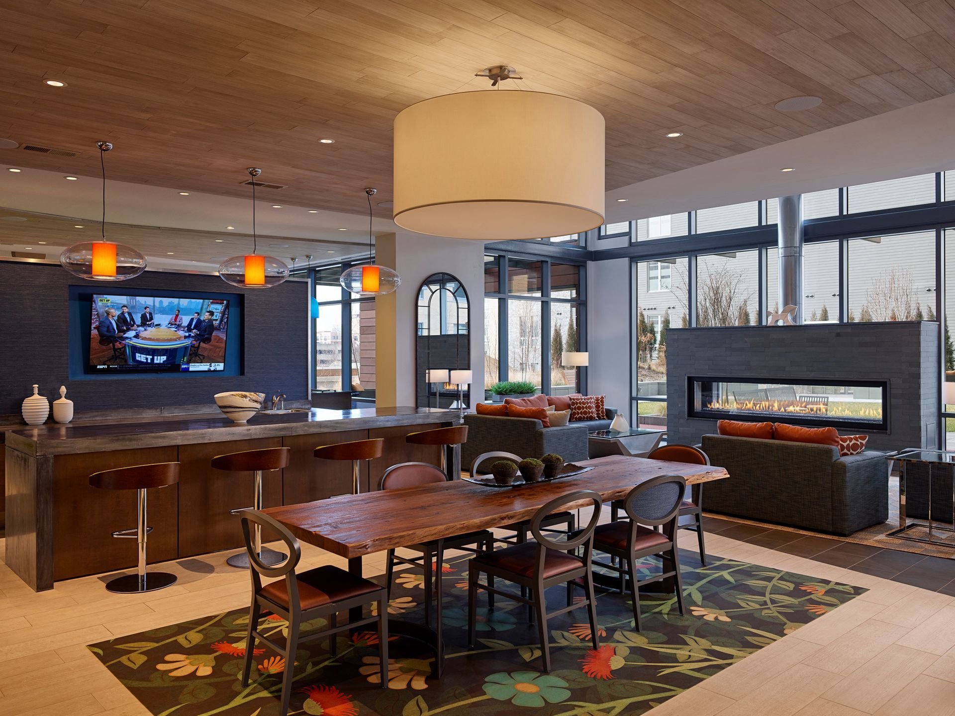 A community lounge area with a kitchen at Solaire 8250 Georgia in Silver Spring, MD.