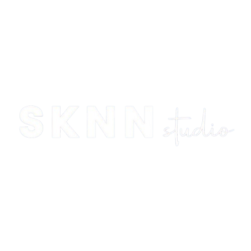 Faint white “SKNN + studio” logo on a plain white background