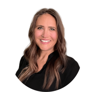 Smiling woman in a black blouse against a white background