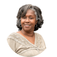 Portrait of a smiling woman in a beige top on a white background