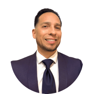 Smiling man in a dark suit and tie on a white background