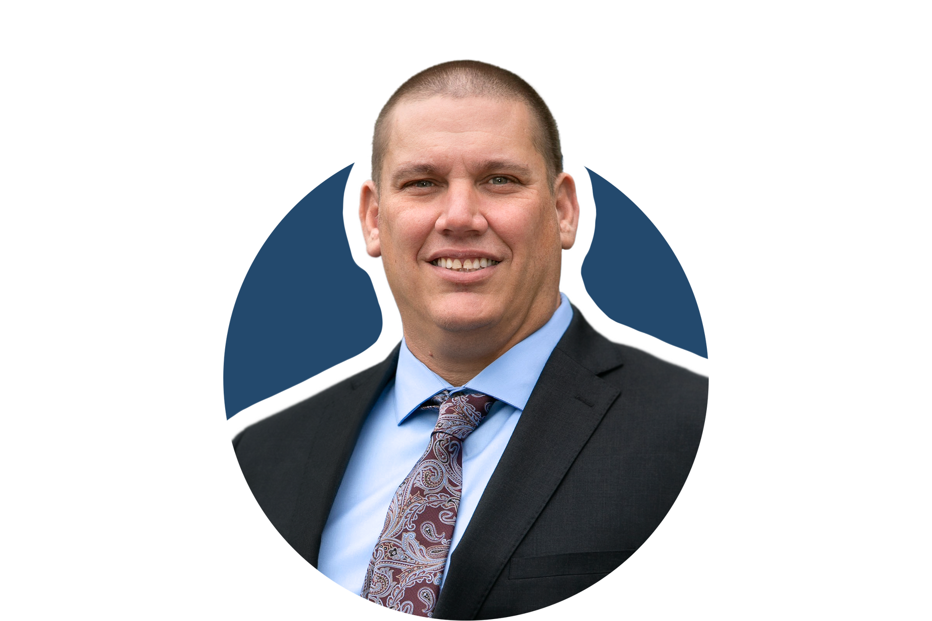 Man in dark suit and patterned tie on a white background with a blue circular accent
