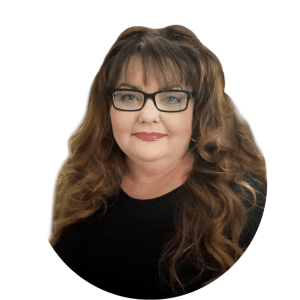 Portrait of a smiling woman with long wavy hair and glasses on a white background