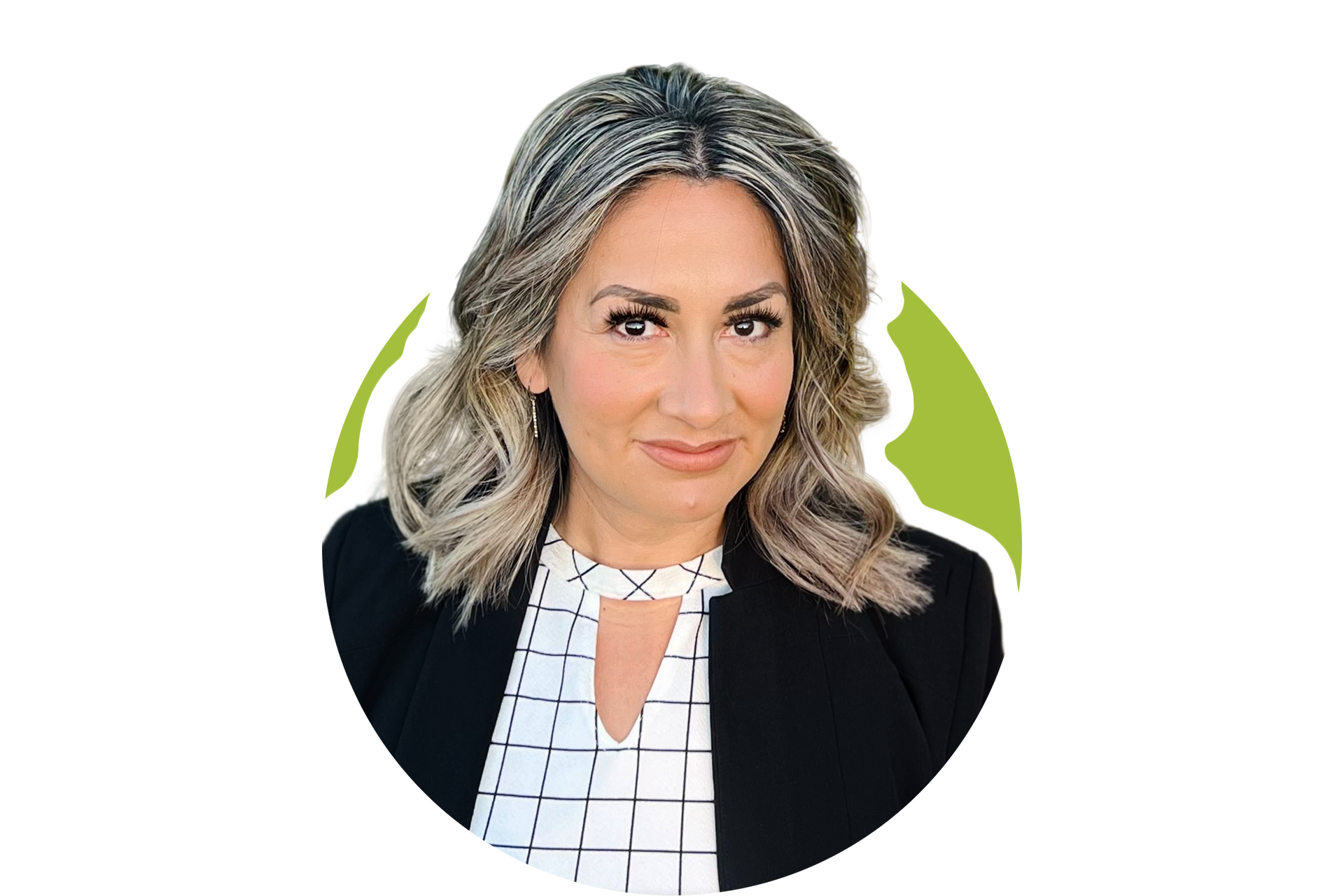 A professional headshot of a person with wavy, highlighted hair, wearing a black blazer over a white, grid-patterned top.