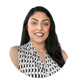 Smiling woman with long dark hair in a black-and-white patterned sleeveless top on a white background