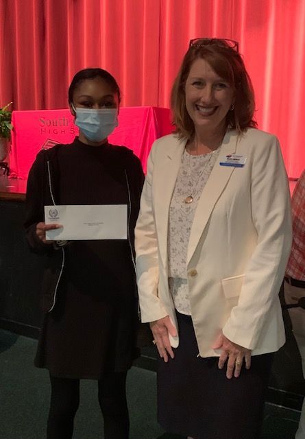 student accepting scholarship