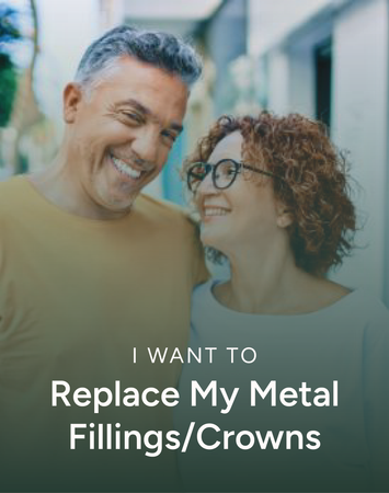Couple smiling outdoors with text: “I want to replace my metal fillings/crowns”