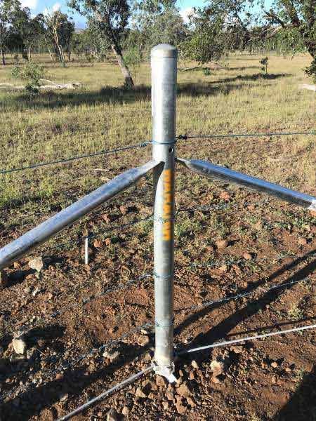 A Metal Fence Is Sitting In The Middle Of A Field — Mulch, Fencing And Landscaping Mackay, QLD