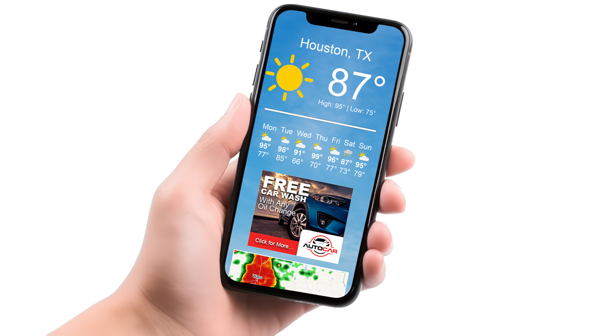 A person is holding a cell phone with the weather on it and an ad showing.