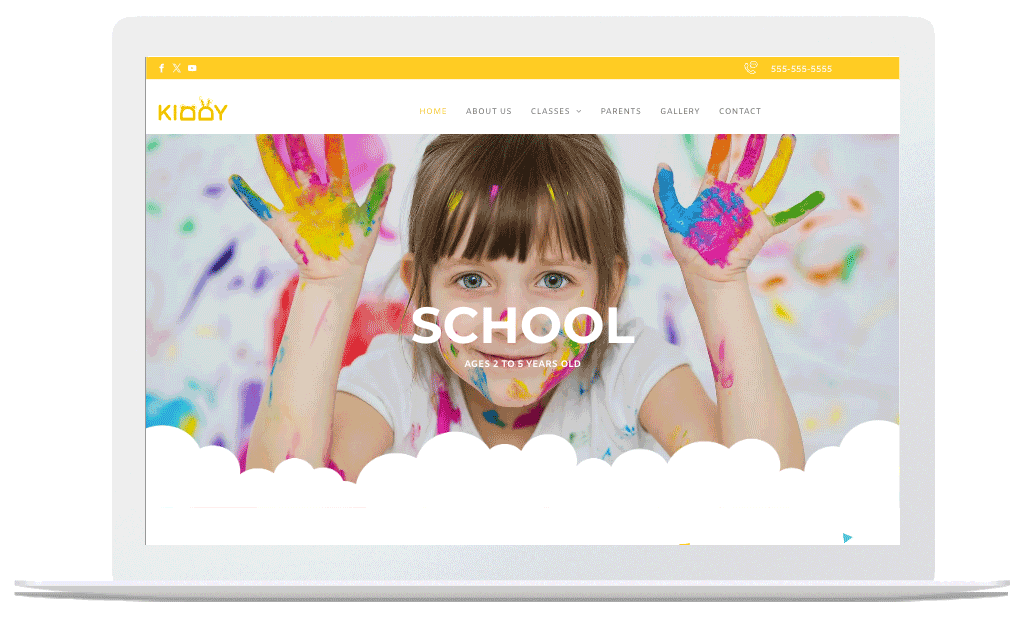 A laptop with a picture of a girl with paint on her hands on the school website.