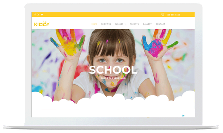 A laptop with a picture of a girl with paint on her hands on the school website.