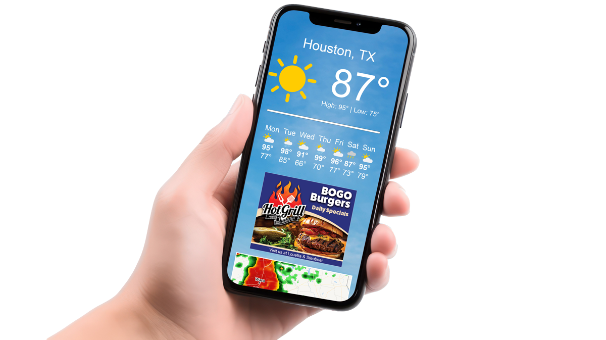 A person is holding a cell phone with the weather on it and an ad showing.