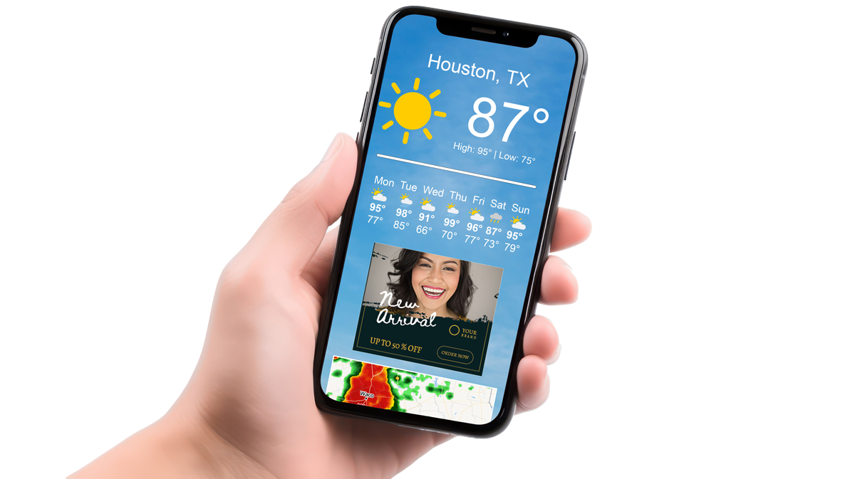 A person is holding a cell phone with a picture of a woman on the screen and an ad showing.