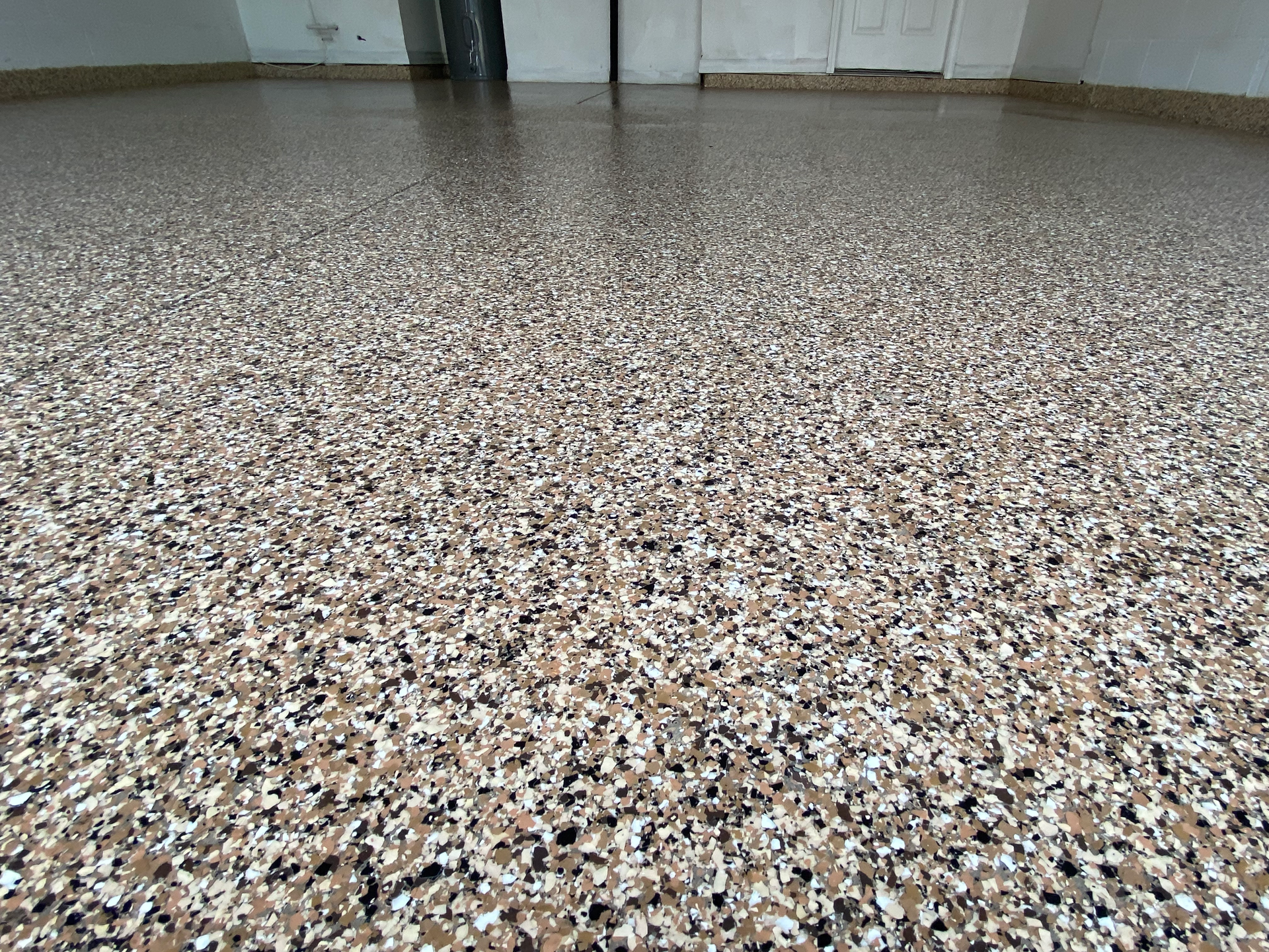 A close up of a concrete floor in a garage.