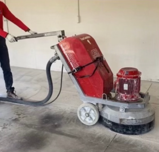 A man is using a machine that has the number 1 on it
