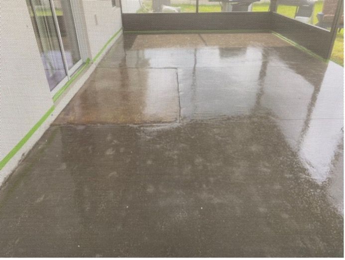 A picture of a concrete floor with a green tape around it