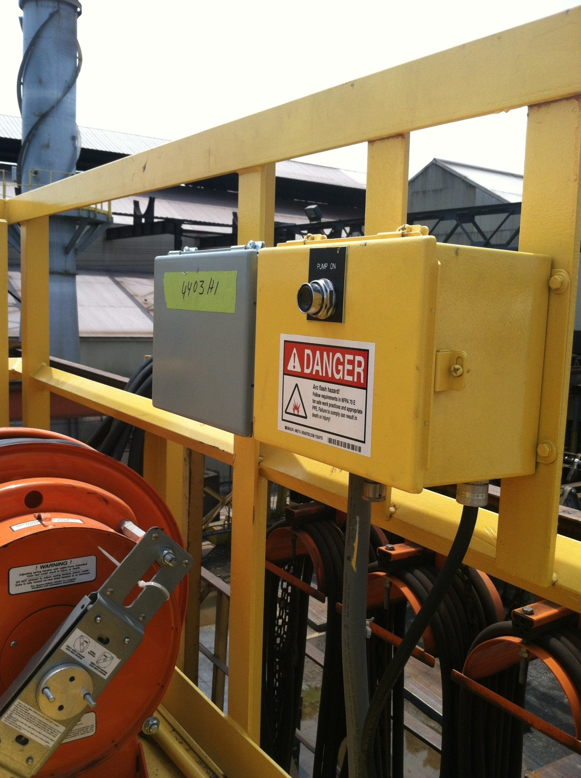 A yellow box with a danger sign on it