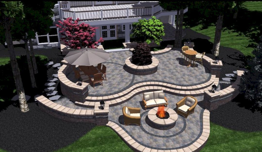 Modern backyard patio with curved stone seating, fire pit, and circular paver walkway in a landscaped garden