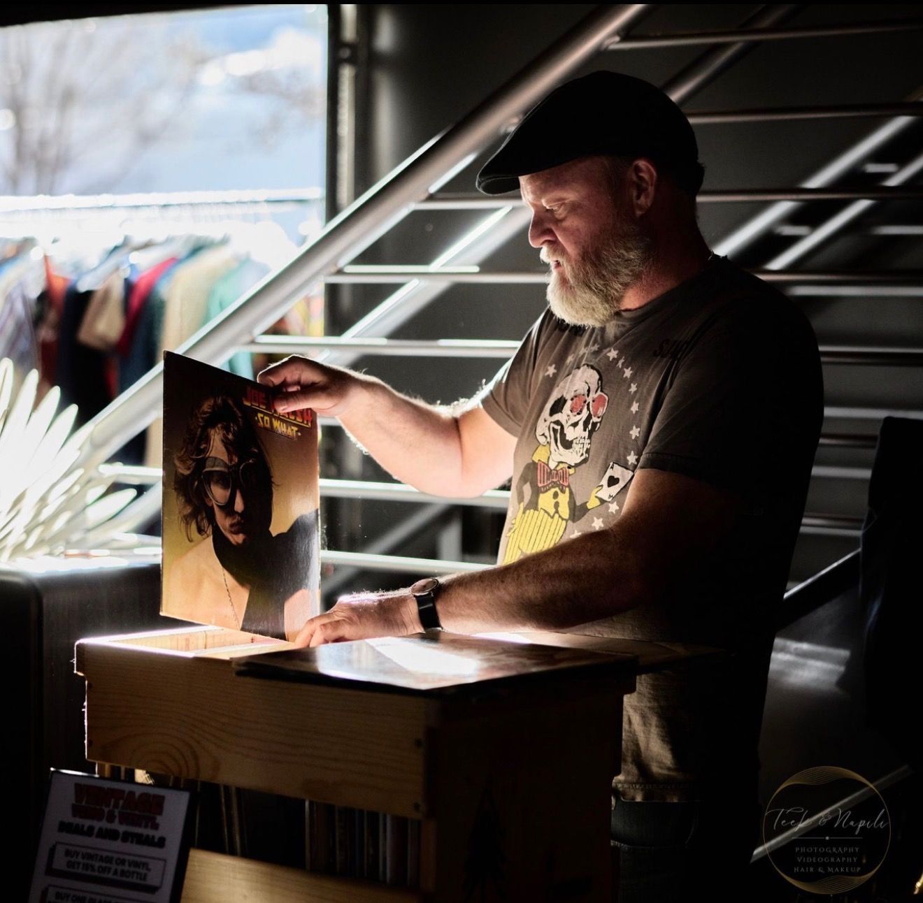 Guest browsing vinyl records at Vintage Vino and Vinyl 80's Night, Resistance Wine Company, Ashland Oregon