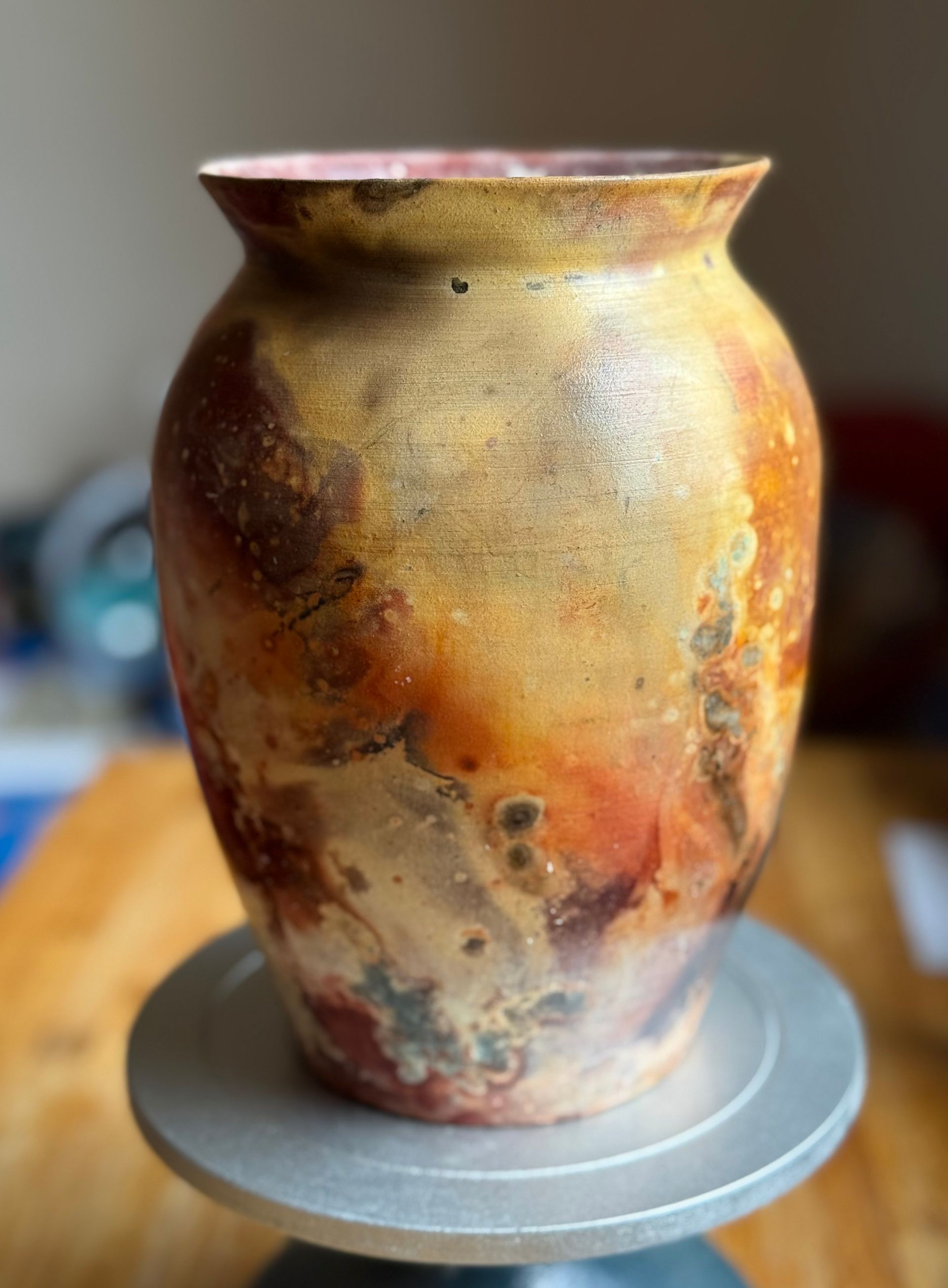 Golden ceramic vase by artist Peter Dylan O'Connor, Resistance Wine Company, Ashland Oregon