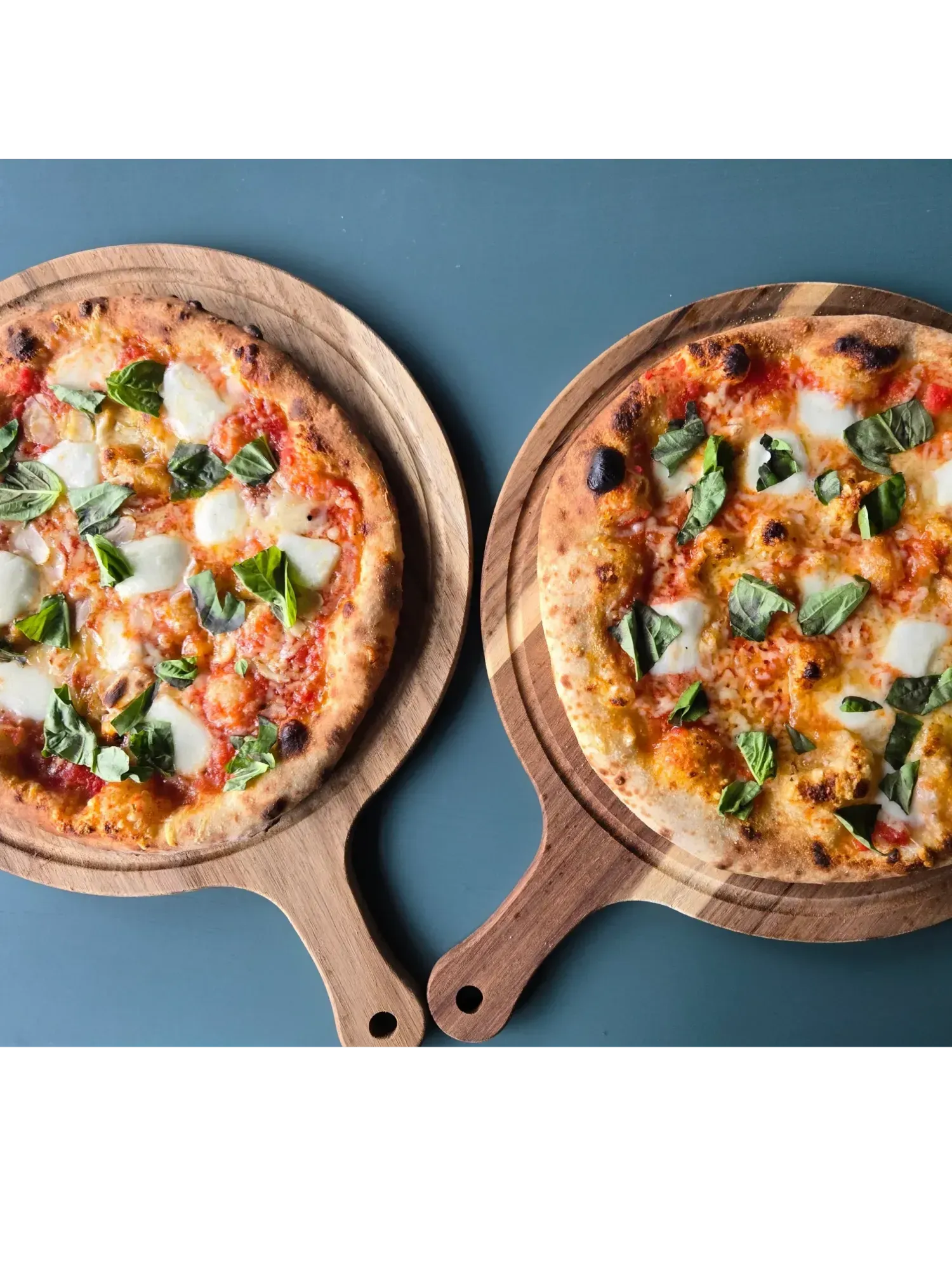 Wood-fired Allium pizza and a glass of Resistance 2023 Sangiovese at the Ashland tasting room