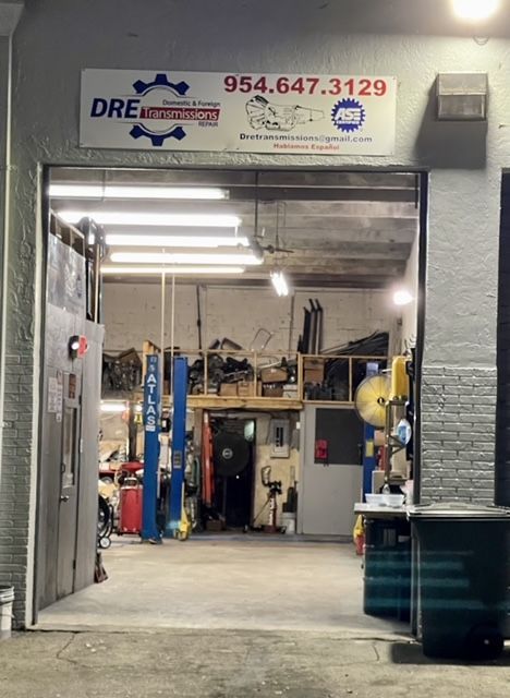 A garage with a sign that says ' dre ' on it