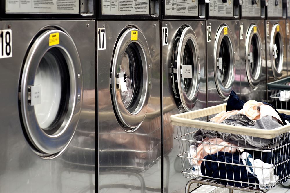 A Row of Washing Machines in a Laundromat — Super Suds Commercial Laundry in Avoca, QLD
