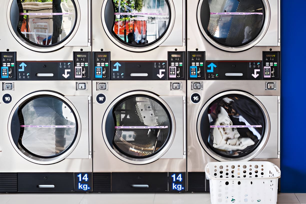 A Row of Washing Machines in a Laundromat — Super Suds Commercial Laundry in Avoca, QLD