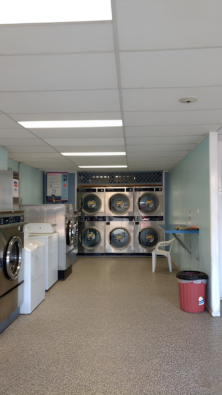 A Laundromat Filled With Washing Machines and Dryers — Super Suds Commercial Laundry in Avoca, QLD