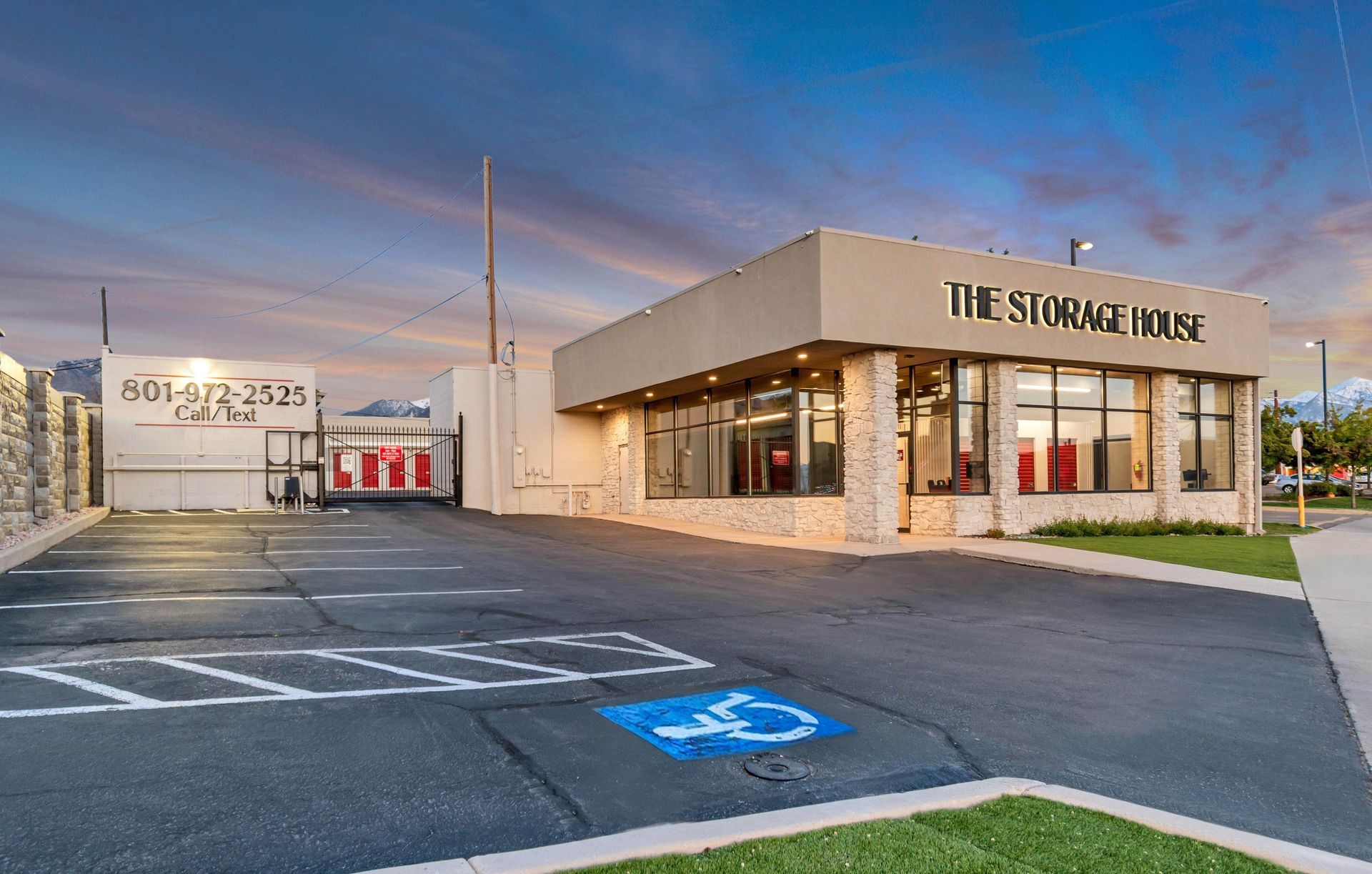 A large building with a handicapped parking spot in front of it.