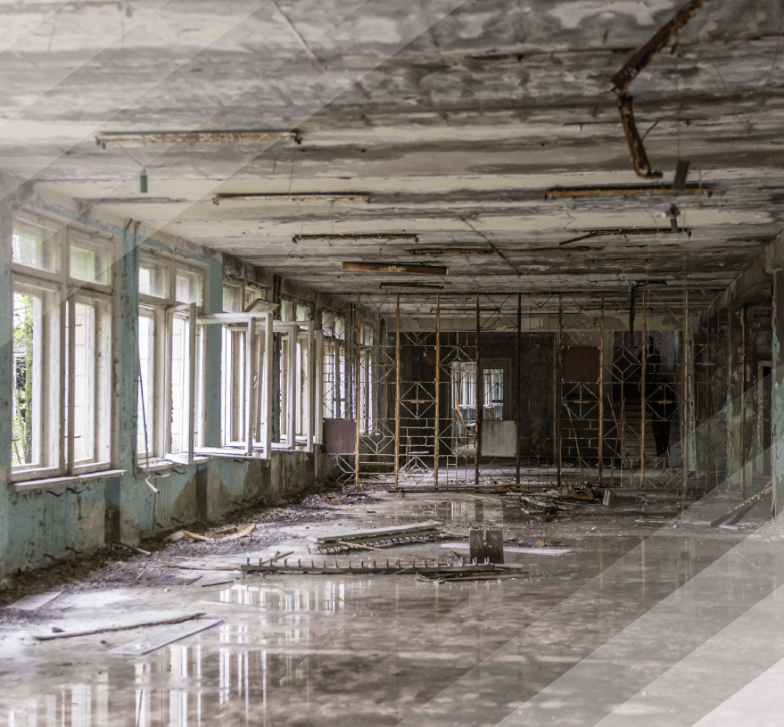 A large empty room with a lot of windows