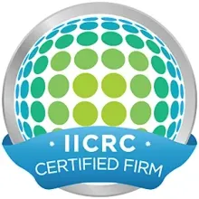 An iicrc certified firm logo with a blue ribbon