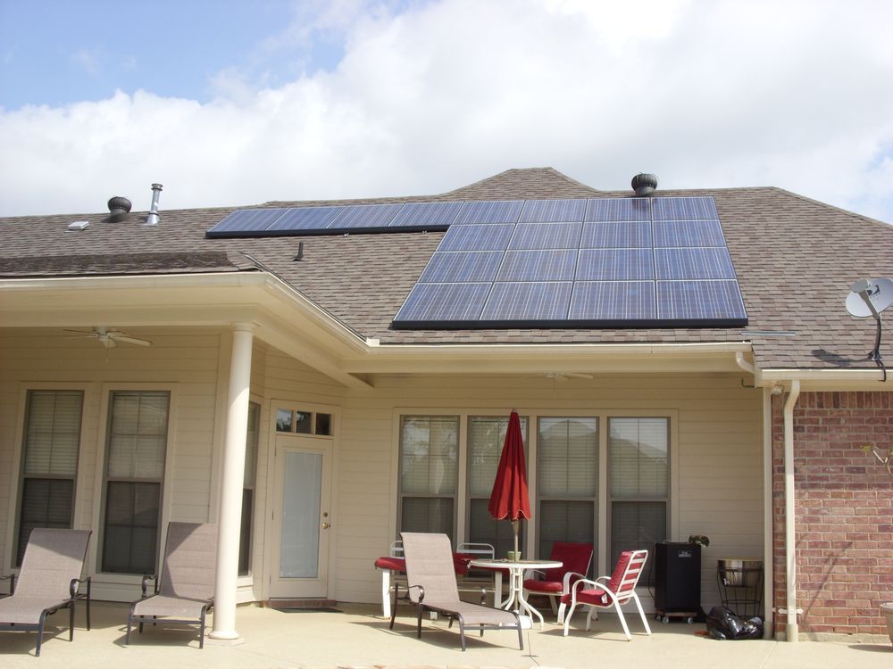 The back of a house with solar panels on the roof