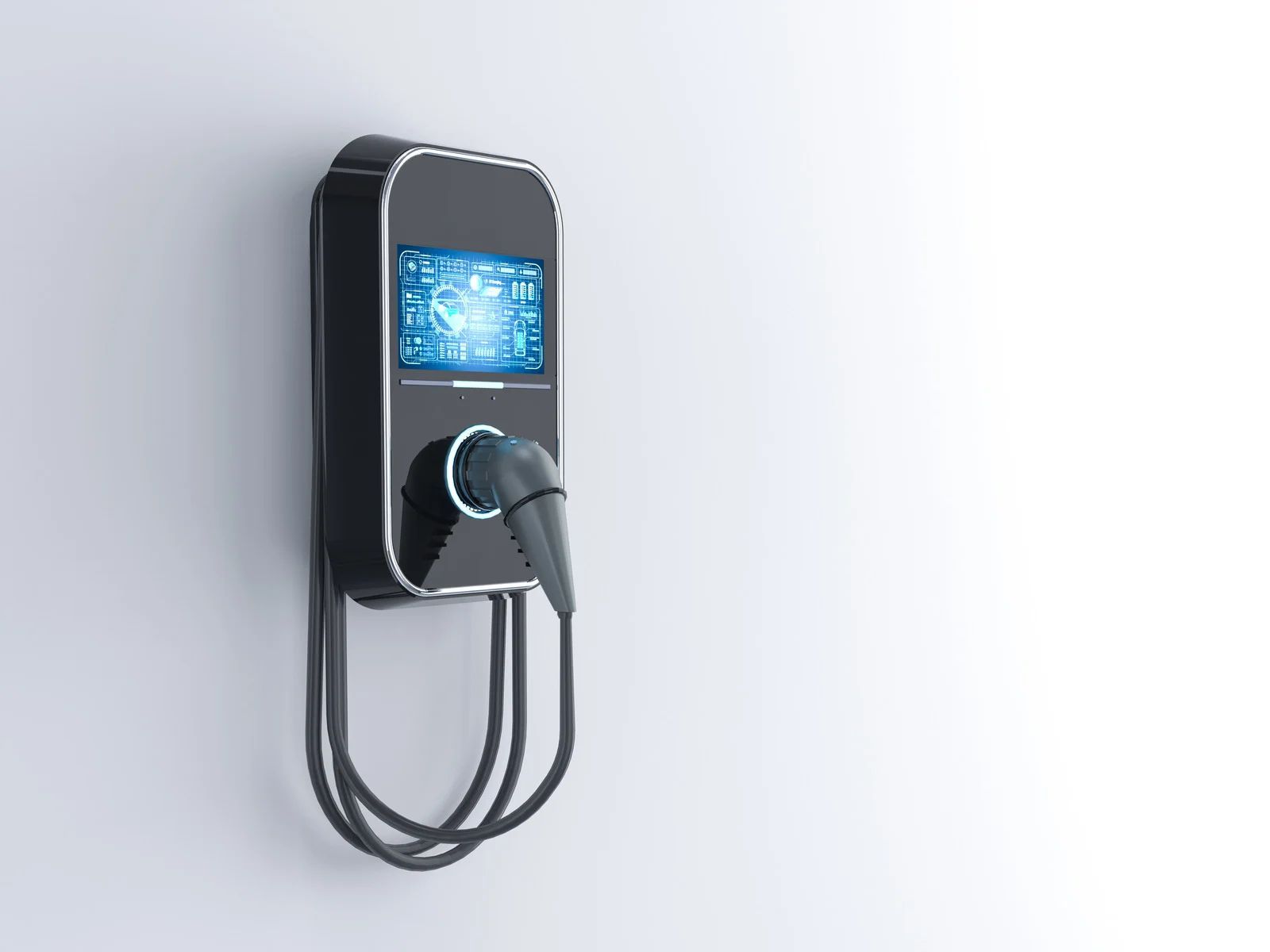 Electric vehicle charging station mounted on a white wall, cable and plug hanging below.